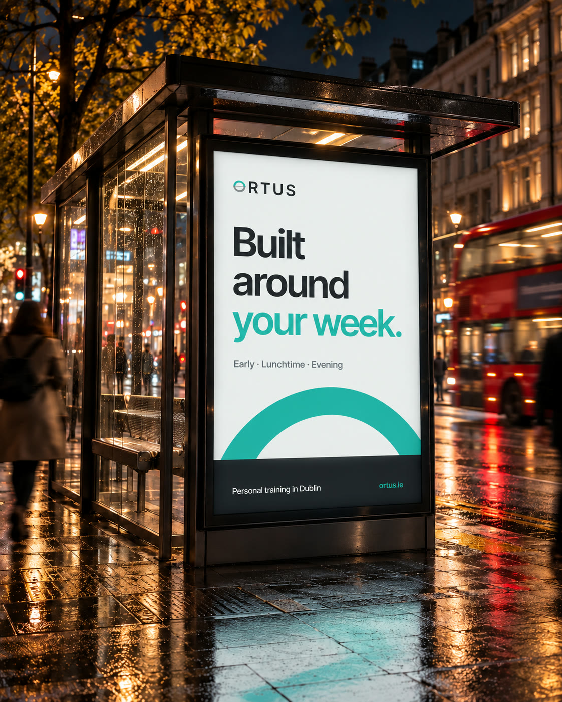 An ORTUS poster in a bus shelter at night: Built around your week.